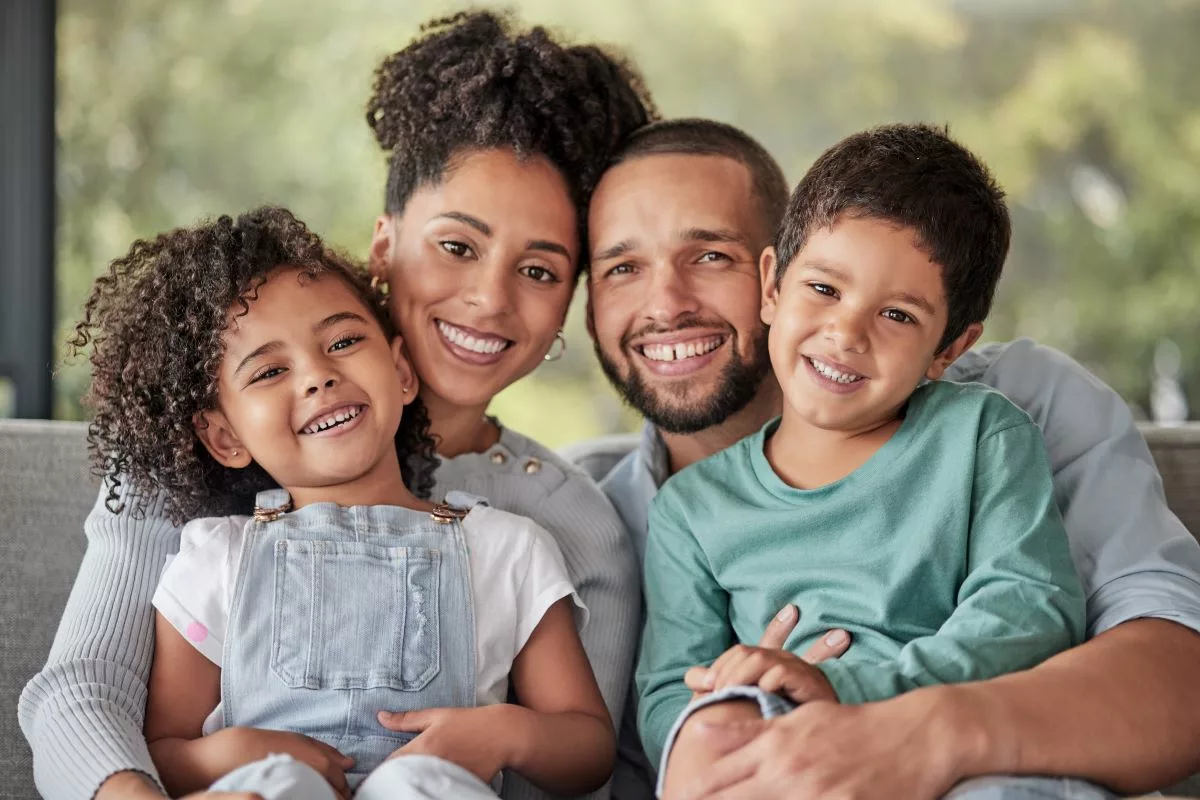 Smiling family enjoying time together, representing the support and benefits provided by the CalWORKs program