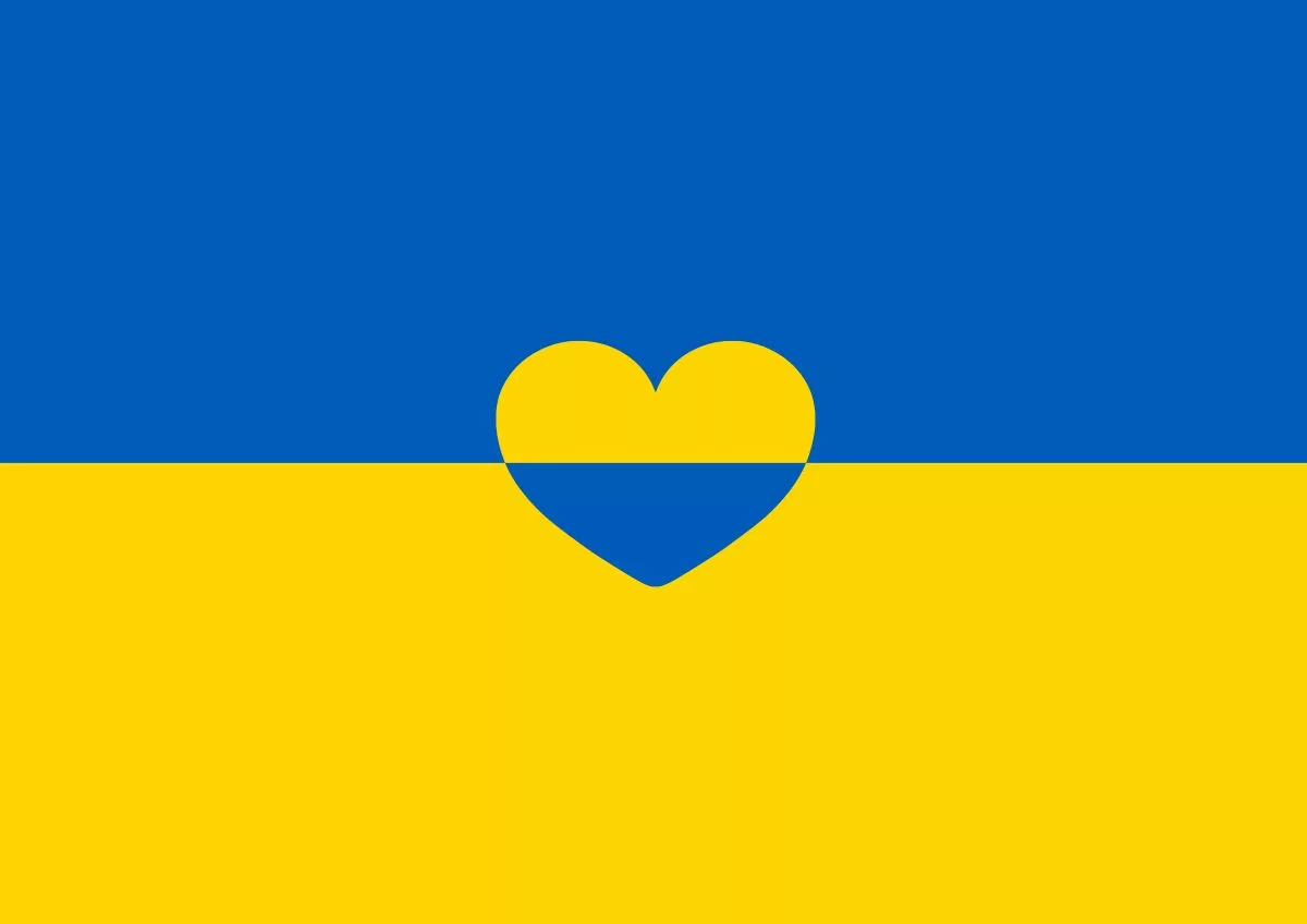 A Ukraine flag with a heart at its center to illustrate the program "Uniting for Ukraine"